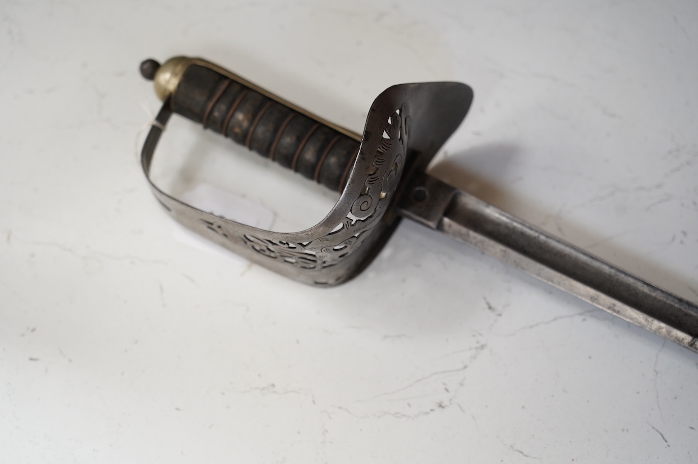 An 1897 pattern infantry officer’s sword, blade etched with crowned VR cypher, steel guard with GVR cypher, blade 83cm. Condition - fair, generally worn